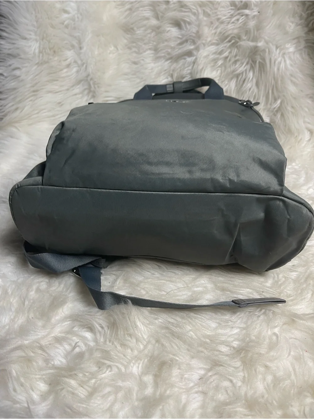 Tumi Voyageur Halsey nylon Gray Backpack with leather Top Handles.